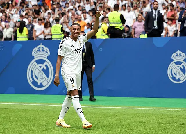 Kylian Mbappe waves at his Real Madrid unveiling