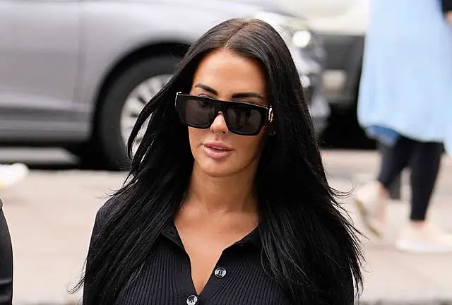 Yazmin Oukhellou wearing dark sunglasses as she arrives at Westminster Magistrates’ Court