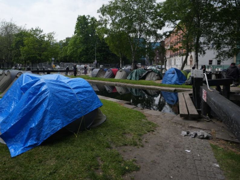 Asylum seeker tents not removed because of Europa League final, insists minister