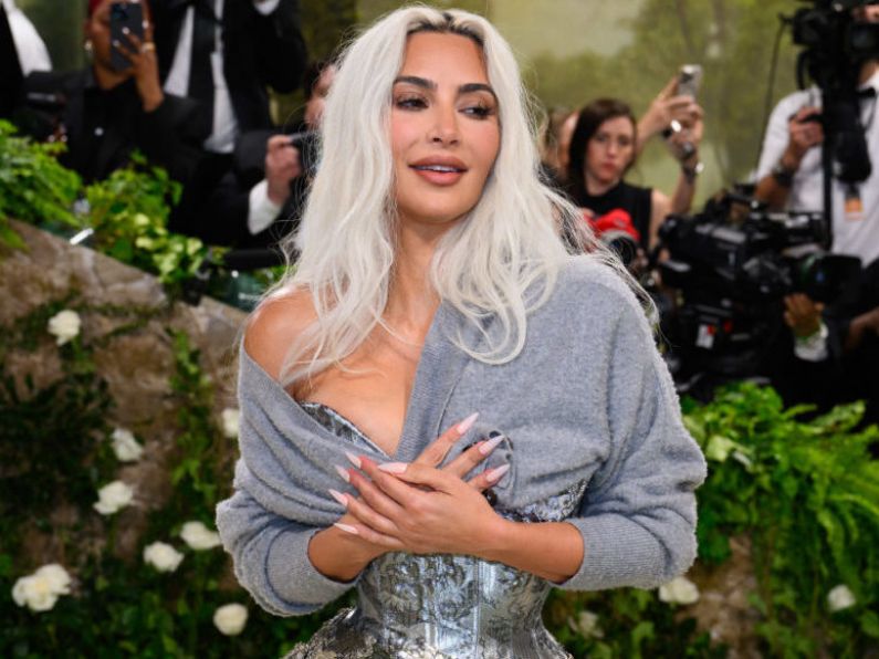 Kim Kardashian says she finds her voice distinct and annoying