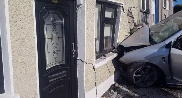 No serious injury in freak car crash that leaves house at risk of collapse