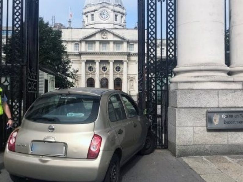 Woman arrested after car crashes into gates of Government Buildings