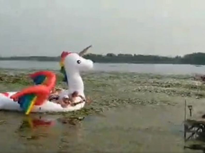 Police rescue a group of women stranded on a floating rainbow unicorn