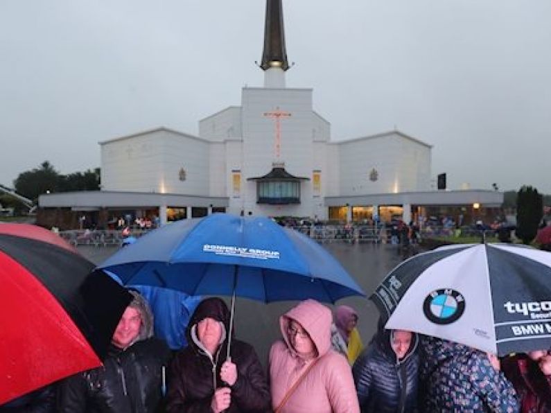 Papal visit sights and sounds: Early crowds brave the rain in Knock