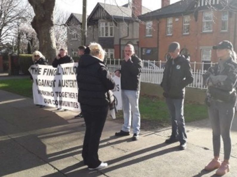 Protesters gather outside home of Minister Richard Bruton