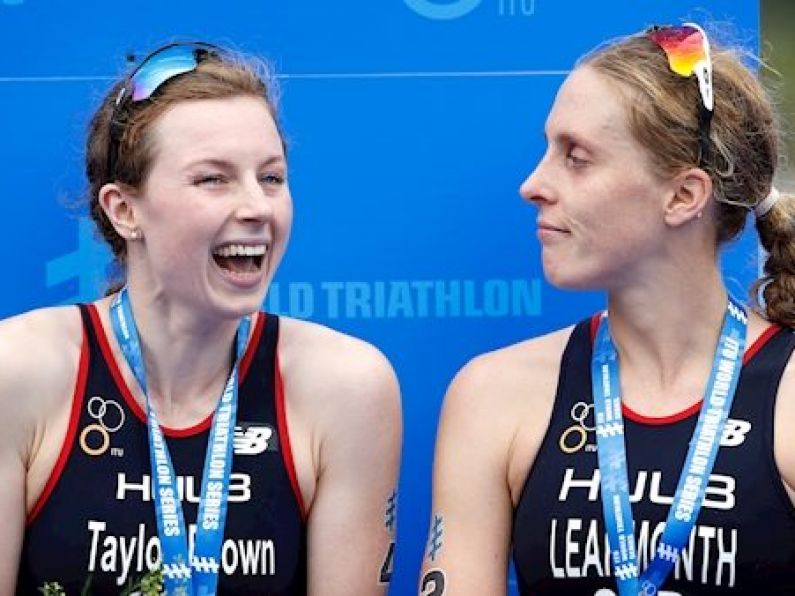 Triathletes disqualified from Olympic qualifier for crossing finish line hand-in-hand
