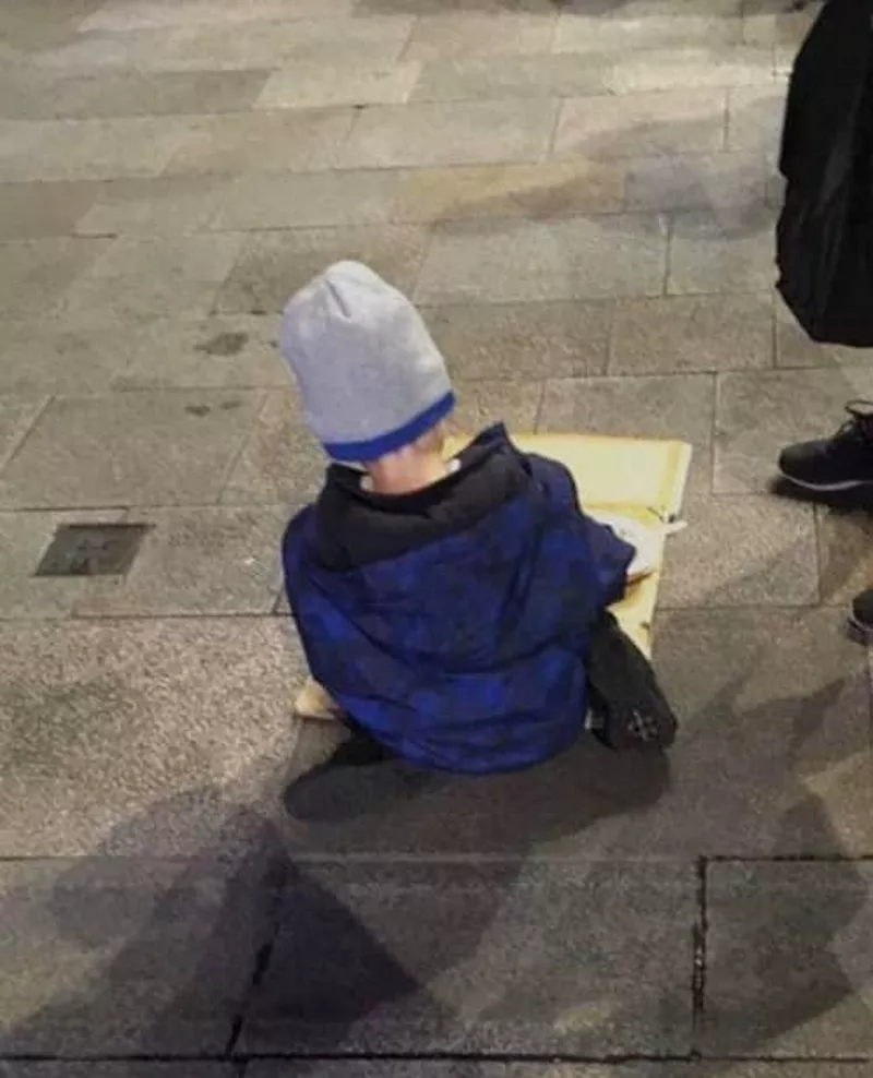 'Can we really accept this?' Photo of homeless boy, 5, eating dinner off cardboard on street sparks outrage