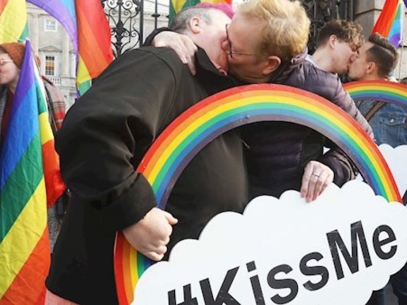LGBT community hold 'kissing' protest outside Dáil against 'frightening surge of hate acts'