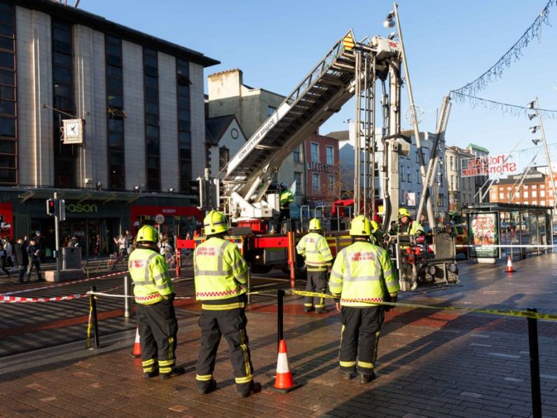 Section of busy shopping street in Cork closed off as chunk of concrete falls from building