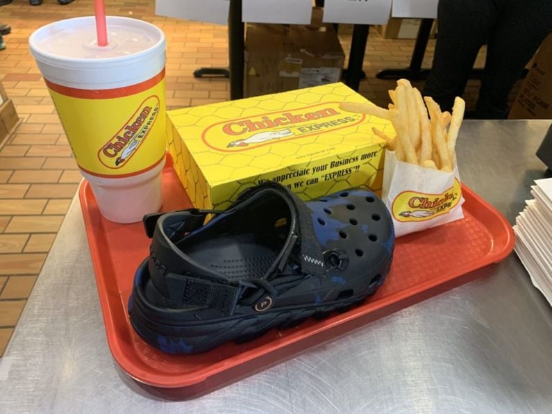 Post Malone gives away pairs of his new Crocs to fans at chicken diner