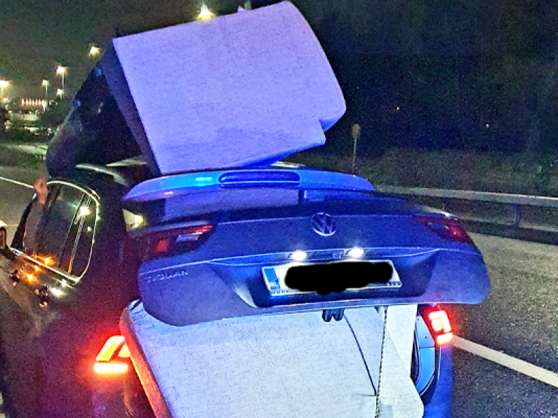 Gardaí stop reckless motorist who daringly transported couch on car roof