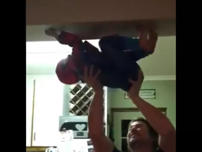 WATCH: Dad helps child pretend to be Spider-Man