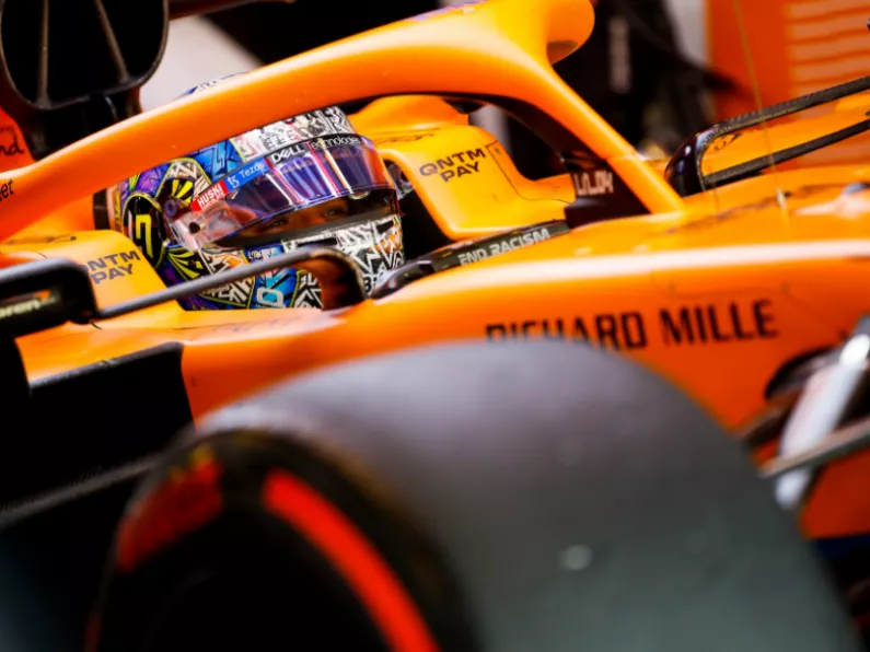 Lando Norris puts pen to paper to sign a new deal with McLaren