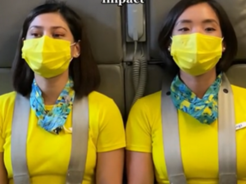 Flight attendant reveals the intriguing reason why they sit on their hands at take-off and landing