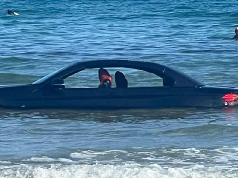 Watch: BMW coupé washes out to sea after parking on popular beach