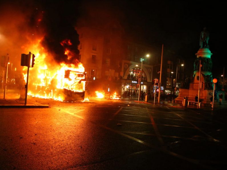 Luas and Dublin Bus set alight as protestors clash with gardaí