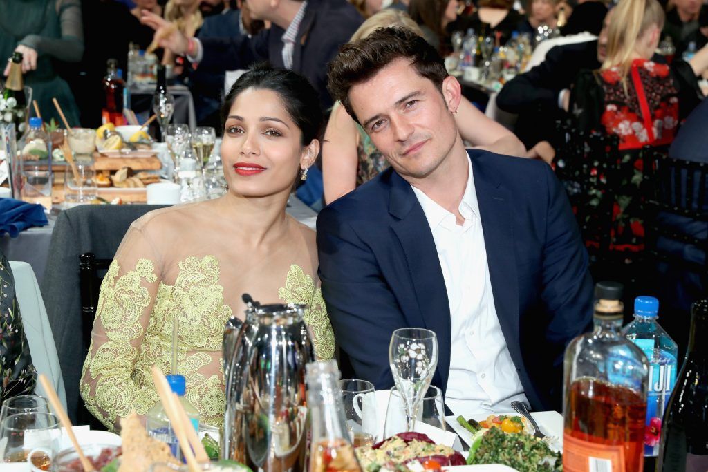 Actors Freida Pinto (L) and Orlando Bloom attend the 32nd Annual Film Independent Spirit Awards sponsored by FIJI Water at Santa Monica Pier on February 25, 2017 in Santa Monica, California.  (Photo by Jonathan Leibson/Getty Images for FIJI Water)
