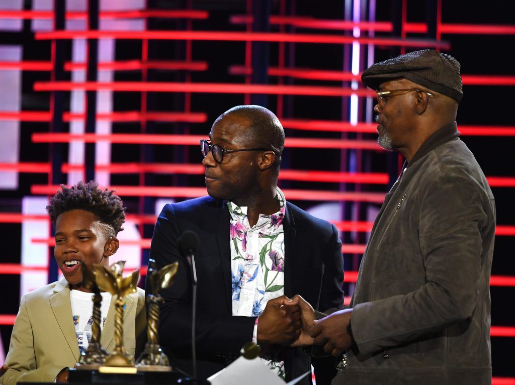 (L-R)  Actor Jaden Piner and filmmaker Barry Jenkins accept the Best Feature award for 'Moonlight' from actor Samuel L. Jackson onstage during the 2017 Film Independent Spirit Awards at the Santa Monica Pier on February 25, 2017 in Santa Monica, California.  (Photo by Kevork Djansezian/Getty Images for Film Independent)