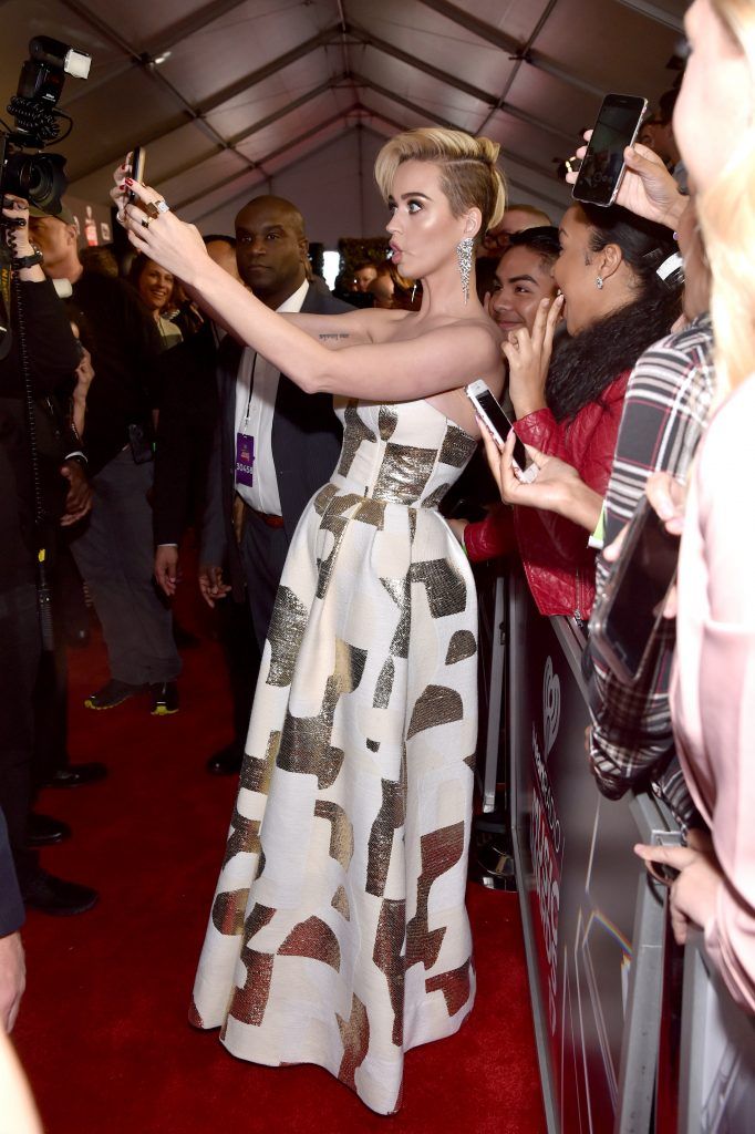 Singer Katy Perry takes a selfie with fans at the 2017 iHeartRadio Music Awards which broadcast live on Turner's TBS, TNT, and truTV at The Forum on March 5, 2017 in Inglewood, California.  (Photo by Frazer Harrison/Getty Images for iHeartMedia)