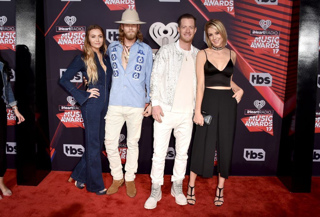 (L-R) Brittney Marie Cole, singers-songwriters Brian Kelley and Tyler Hubbard of music group Florida Georgia Line, and Hayley Stommel attend the 2017 iHeartRadio Music Awards which broadcast live on Turner's TBS, TNT, and truTV at The Forum on March 5, 2017 in Inglewood, California.  (Photo by Alberto E. Rodriguez/Getty Images)