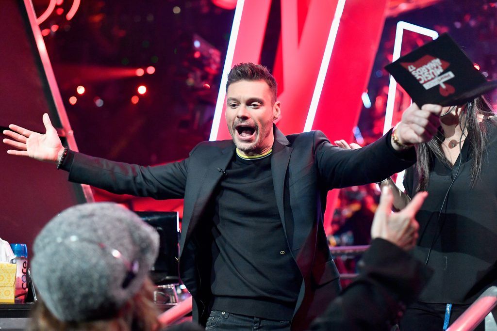 Host Ryan Seacrest speaks onstage at the 2017 iHeartRadio Music Awards which broadcast live on Turner's TBS, TNT, and truTV at The Forum on March 5, 2017 in Inglewood, California.  (Photo by Frazer Harrison/Getty Images for iHeartMedia)
