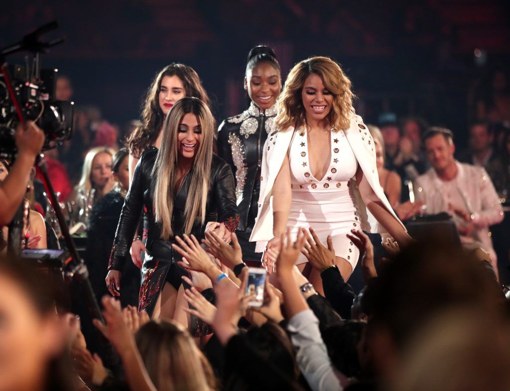 (L-R) Singers Lauren Jauregui, Ally Brooke, Normani Kordei, and Dinah Jane of music group Fifth Harmony react during the 2017 iHeartRadio Music Awards which broadcast live on Turner's TBS, TNT, and truTV at The Forum on March 5, 2017 in Inglewood, California.  (Photo by Christopher Polk/Getty Images for iHeartMedia)