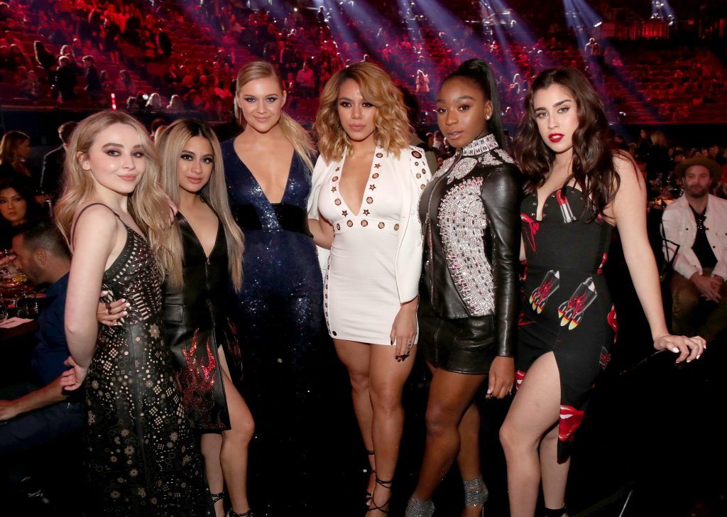 Singers Sabrina Carpenter (L) and Kelsea Ballerini (3rd from L) pose with singers (from 2nd L) Ally Brooke, Dinah Jane, Normani Kordei, and Lauren Jauregui of music group Fifth Harmony during the 2017 iHeartRadio Music Awards which broadcast live on Turner's TBS, TNT, and truTV at The Forum on March 5, 2017 in Inglewood, California.  (Photo by Christopher Polk/Getty Images for iHeartMedia)