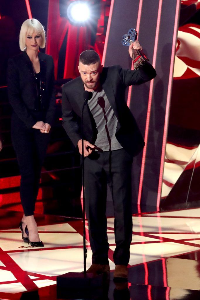 Singer Justin Timberlake accepts the Song of the Year award for 'Can't Stop The Feeling' from actor Jeremy Renner onstage at the 2017 iHeartRadio Music Awards which broadcast live on Turner's TBS, TNT, and truTV at The Forum on March 5, 2017 in Inglewood, California.  (Photo by Rich Polk/Getty Images for iHeartMedia)