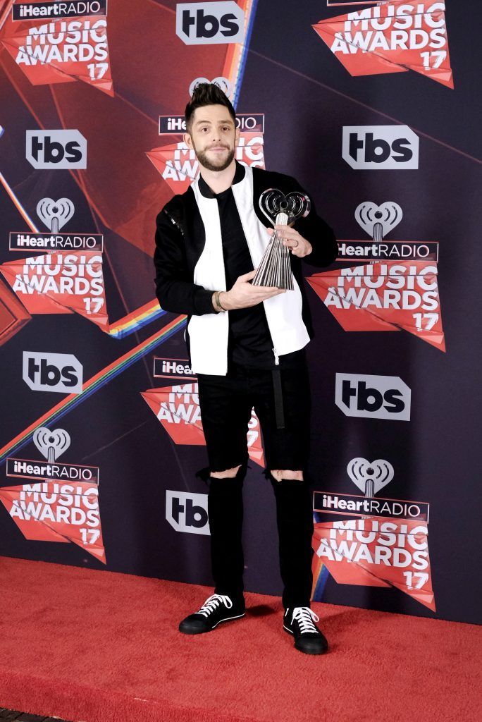 Singer-songwriter Thomas Rhett, winner of the Country Artist of the Year award, poses in the press room at the 2017 iHeartRadio Music Awards which broadcast live on Turner's TBS, TNT, and truTV at The Forum on March 5, 2017 in Inglewood, California.  (Photo by Alberto E. Rodriguez/Getty Images)