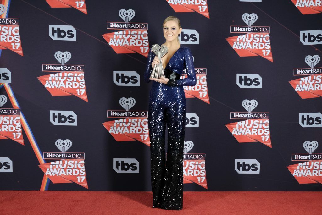 Singer-songwriter Kelsea Ballerini, winner of the Best New Country Artist award, poses in the press room at the 2017 iHeartRadio Music Awards which broadcast live on Turner's TBS, TNT, and truTV at The Forum on March 5, 2017 in Inglewood, California.  (Photo by Alberto E. Rodriguez/Getty Images)