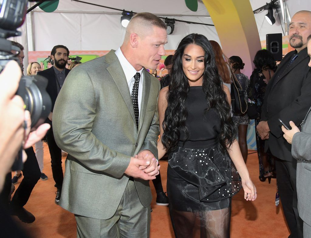 Host John Cena (L) and professional wrestler Nikki Bella at Nickelodeon's 2017 Kids' Choice Awards at USC Galen Center on March 11, 2017 in Los Angeles, California.  (Photo by Charley Gallay/Getty Images)