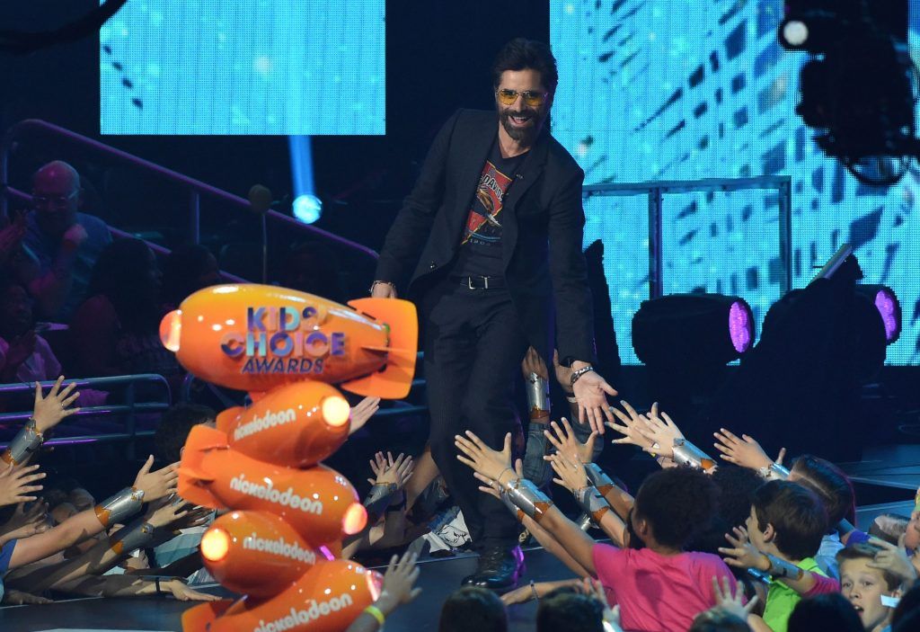 John Stamos on stage at the 30th Annual Nickelodeon Kids' Choice Awards, March 11, 2017, at the Galen Center on the University of Southern California campus in Los Angeles. (Photo by VALERIE MACON/AFP/Getty Images)