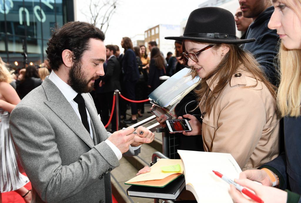 Actor George Blagden signs an autograph at THREE Empire awards at The Roundhouse on March 19, 2017 in London, England.  (Photo by Ian Gavan/Getty Images)