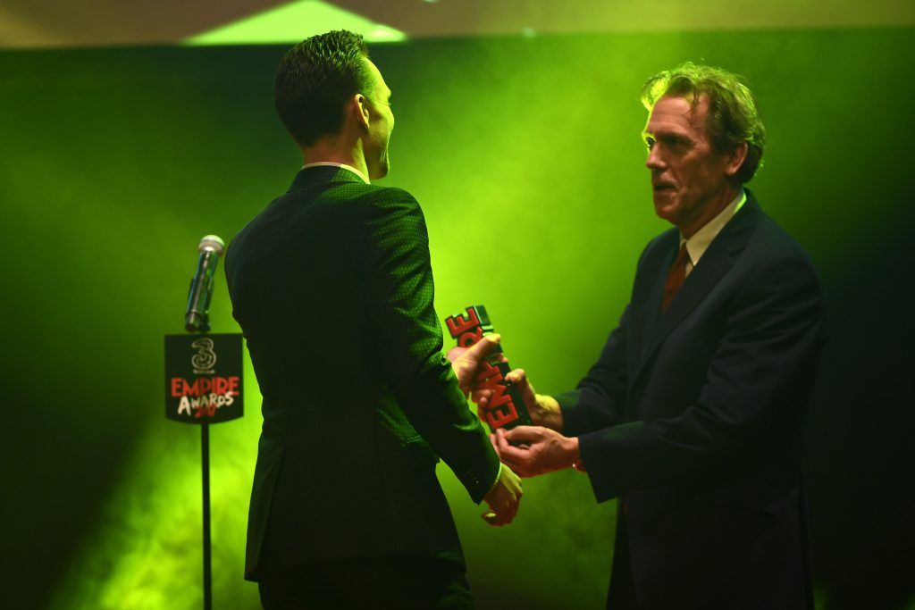 Hugh Laurie presents the Empire Hero award to Tom Hiddleston (L) during the THREE Empire awards at The Roundhouse on March 19, 2017 in London, England.  (Photo by Ian Gavan/Getty Images)