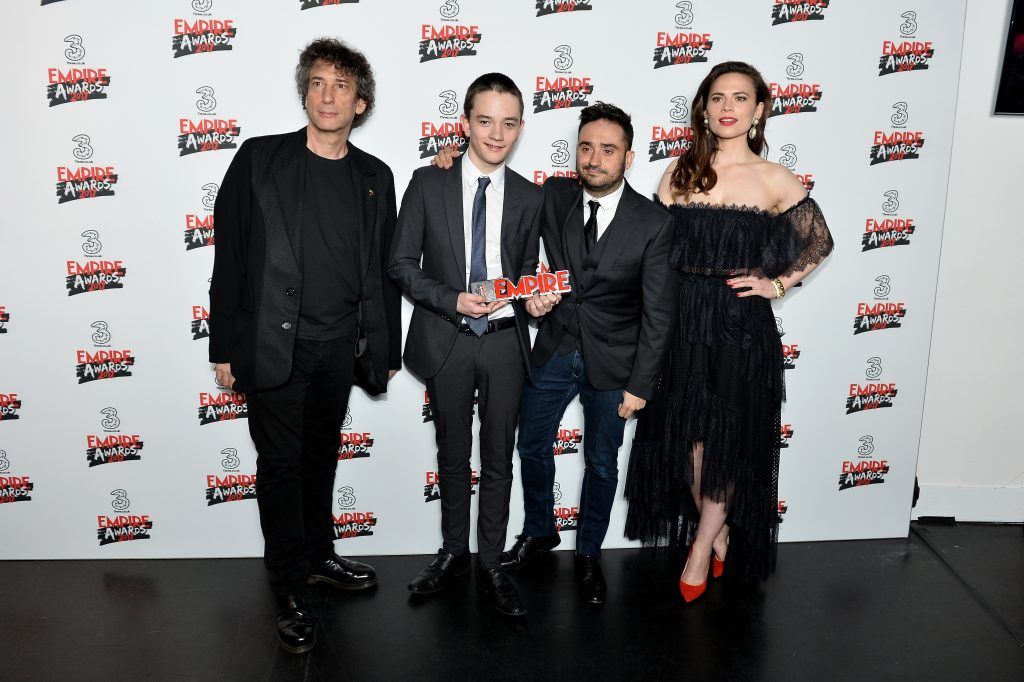 Presenters Neil Gaiman (L) and Hayley Atwell (R) and winners of the Best Sci-fi/Fantasy award for the movie 'A Monster Calls' actor Lewis MacDougall (2ndL) and director Juan Antonio Bayona (2ndR) pose in the winners room at the THREE Empire awards at The Roundhouse on March 19, 2017 in London, England.  (Photo by Jeff Spicer/Getty Images)
