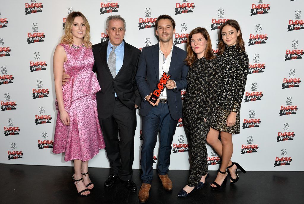 Winners of the Best Documentary award for 'Supersonic', director Matt Whitecross (C) and producers Simon Halfon (2ndL) and Fiona Neilson (2ndR) pose in the winners room with presenters Laura Carmichael and Ella Purnell at the THREE Empire awards at The Roundhouse on March 19, 2017 in London, England.  (Photo by Jeff Spicer/Getty Images)