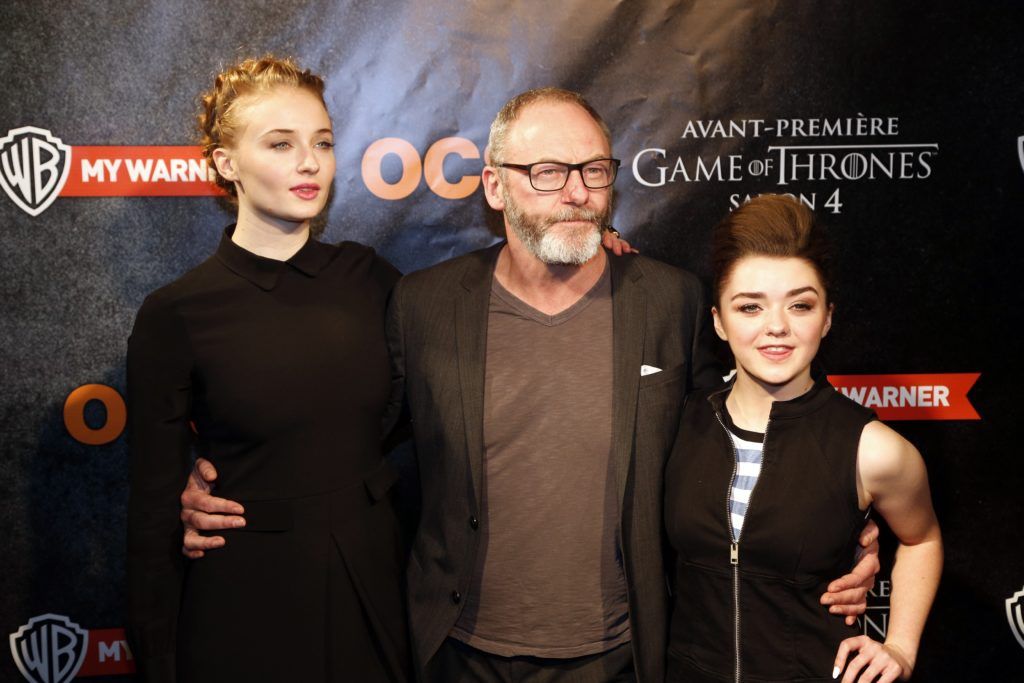 Sophie Turner, Liam Cunningham and Maisie Williams pose during a photocall for the premiere of the fourth season of American television series "Game of Thrones" in Paris on April 2, 2014. AFP PHOTO / FRANCOIS GUILLOT         (Photo credit should read FRANCOIS GUILLOT/AFP/Getty Images)