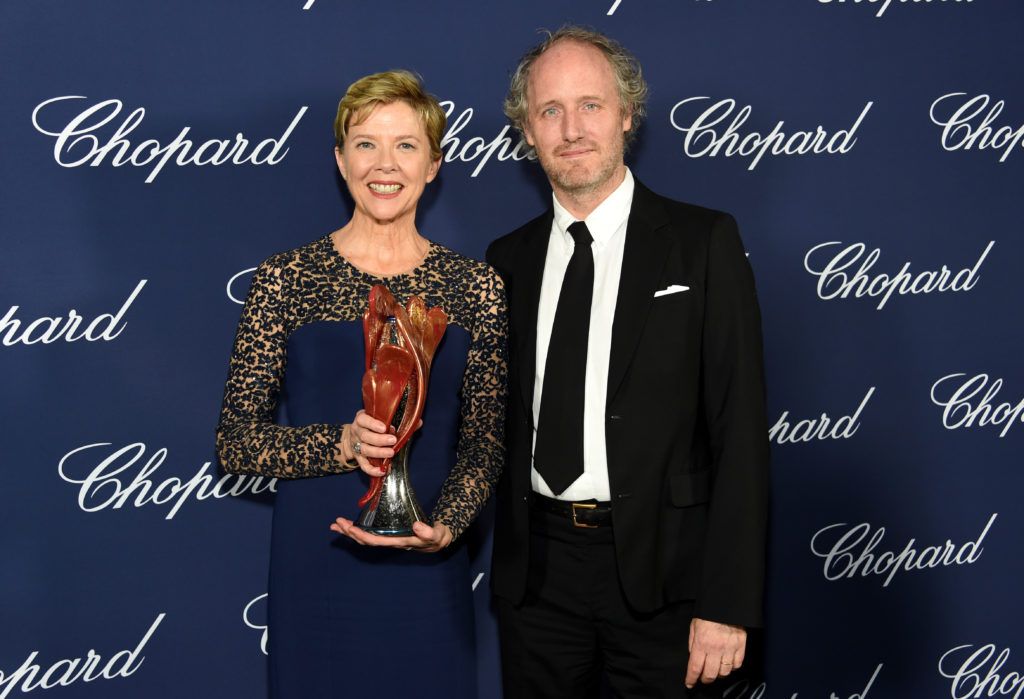 Annette Bening poses with the Career Achievement Award and director Mike Mills during the 28th Annual Palm Springs International Film Festival Film Awards Gala at the Palm Springs Convention Center on January 2, 2017 in Palm Springs, California.  (Photo by Michael Kovac/Getty Images for Palm Springs International Film Festival)