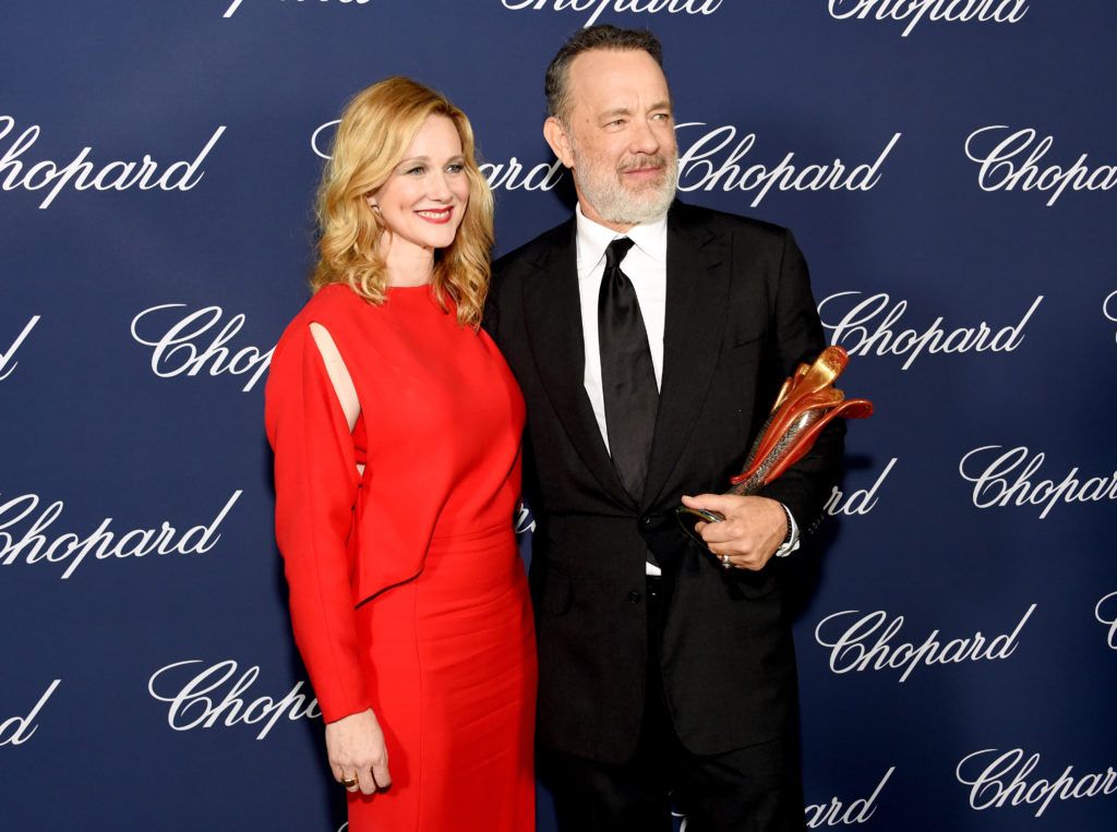 Tom Hanks poses with the Icon Award and actress Laura Linney during the 28th Annual Palm Springs International Film Festival Film Awards Gala at the Palm Springs Convention Center on January 2, 2017 in Palm Springs, California.  (Photo by Michael Kovac/Getty Images for Palm Springs International Film Festival)