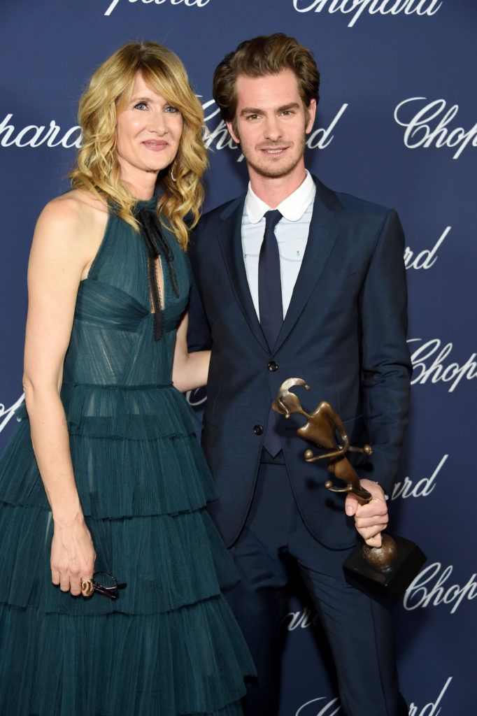 Andrew Garfield poses with the Spotlight Award and actress Laura Dern during the 28th Annual Palm Springs International Film Festival Film Awards Gala at the Palm Springs Convention Center on January 2, 2017 in Palm Springs, California.  (Photo by Michael Kovac/Getty Images for Palm Springs International Film Festival)