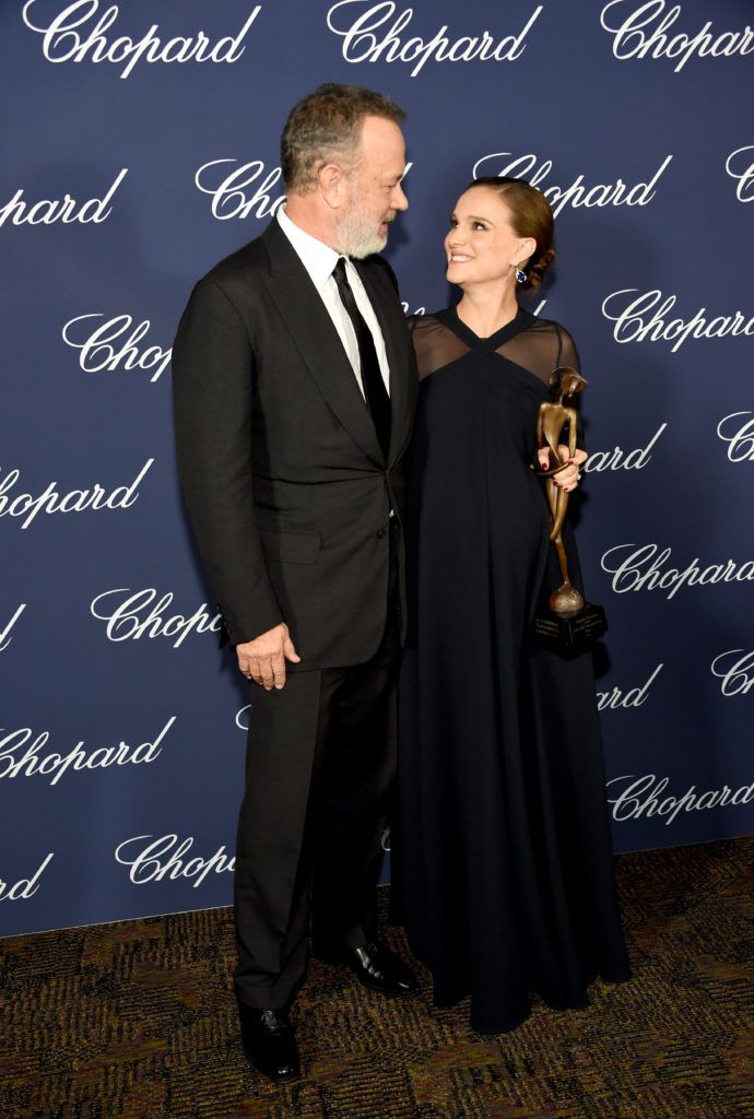 Natalie Portman poses with the Desert Palm Achievement Award and actor Tom Hanks during the 28th Annual Palm Springs International Film Festival Film Awards Gala at the Palm Springs Convention Center on January 2, 2017 in Palm Springs, California.  (Photo by Michael Kovac/Getty Images for Palm Springs International Film Festival)