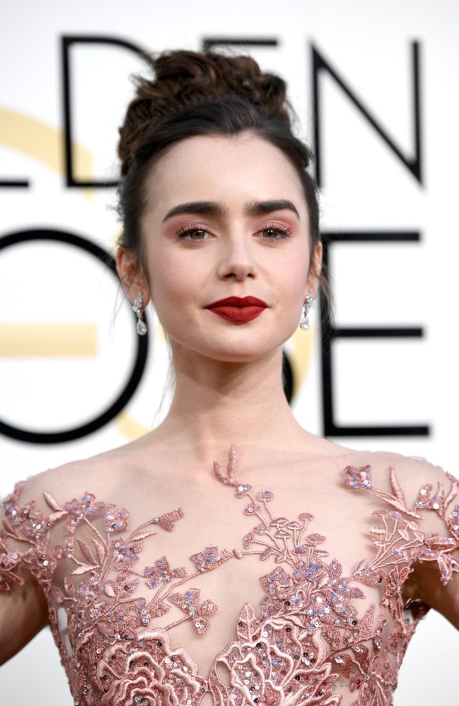 BEVERLY HILLS, CA - JANUARY 08:  Actress Lily Collins attends the 74th Annual Golden Globe Awards at The Beverly Hilton Hotel on January 8, 2017 in Beverly Hills, California.  (Photo by Frazer Harrison/Getty Images)