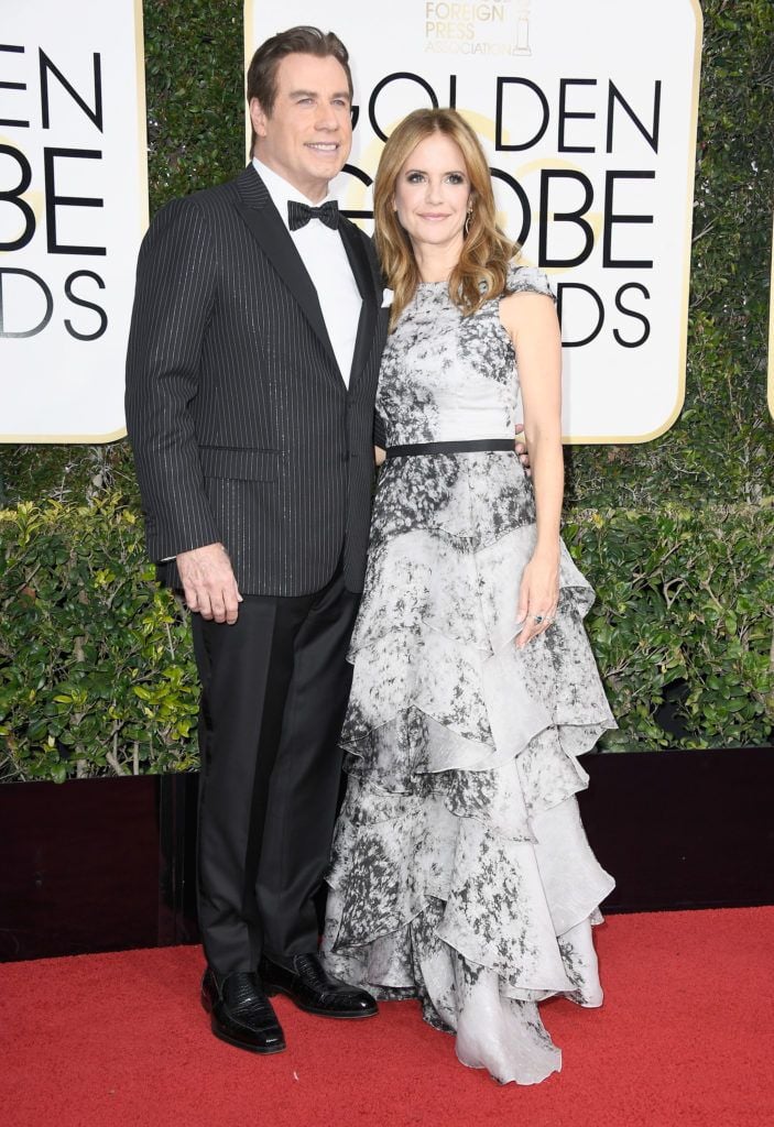 BEVERLY HILLS, CA - JANUARY 08:  Actors John Travolta (L) and Kelly Preston attend the 74th Annual Golden Globe Awards at The Beverly Hilton Hotel on January 8, 2017 in Beverly Hills, California.  (Photo by Frazer Harrison/Getty Images)
