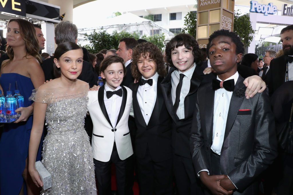 BEVERLY HILLS, CA - JANUARY 08:  (L-R) Actors Millie Bobby Brown, Noah Schnapp, Gaten Matarazzo, Finn Wolfhard and Caleb McLaughlin at the 74th annual Golden Globe Awards sponsored by FIJI Water at The Beverly Hilton Hotel on January 8, 2017 in Beverly Hills, California.  (Photo by Jonathan Leibson/Getty Images for FIJI Water)