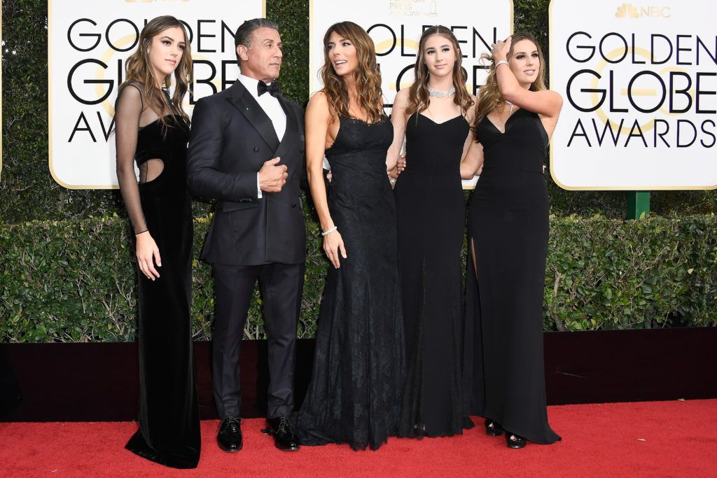 BEVERLY HILLS, CA - JANUARY 08:  Actor Sylvester Stallone (2nd L), model Jennifer Flavin (C), and (L-R) 2017 Miss Golden Globe Sistine Stallon, Scarlet Stallone and Sophia Stallone attend the 74th Annual Golden Globe Awards at The Beverly Hilton Hotel on January 8, 2017 in Beverly Hills, California.  (Photo by Frazer Harrison/Getty Images)