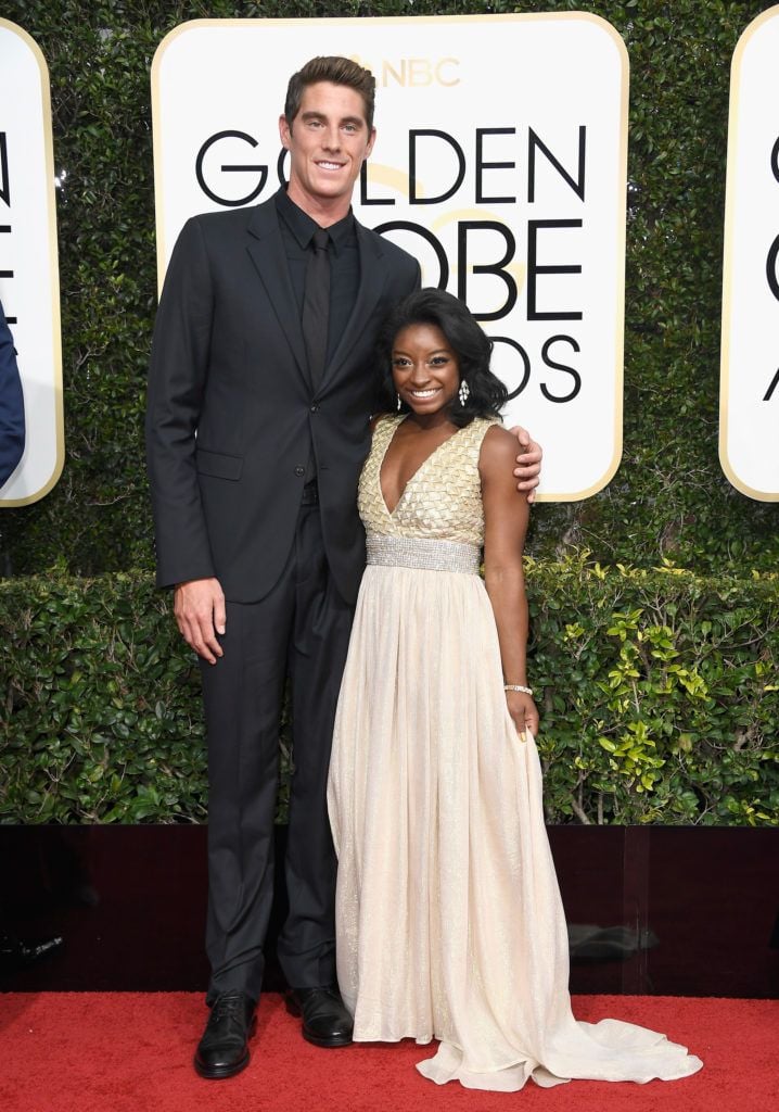 BEVERLY HILLS, CA - JANUARY 08: (L-R) Swimmer Conor Dwyer and gymnast Simone Biles attend the 74th Annual Golden Globe Awards at The Beverly Hilton Hotel on January 8, 2017 in Beverly Hills, California.  (Photo by Frazer Harrison/Getty Images)