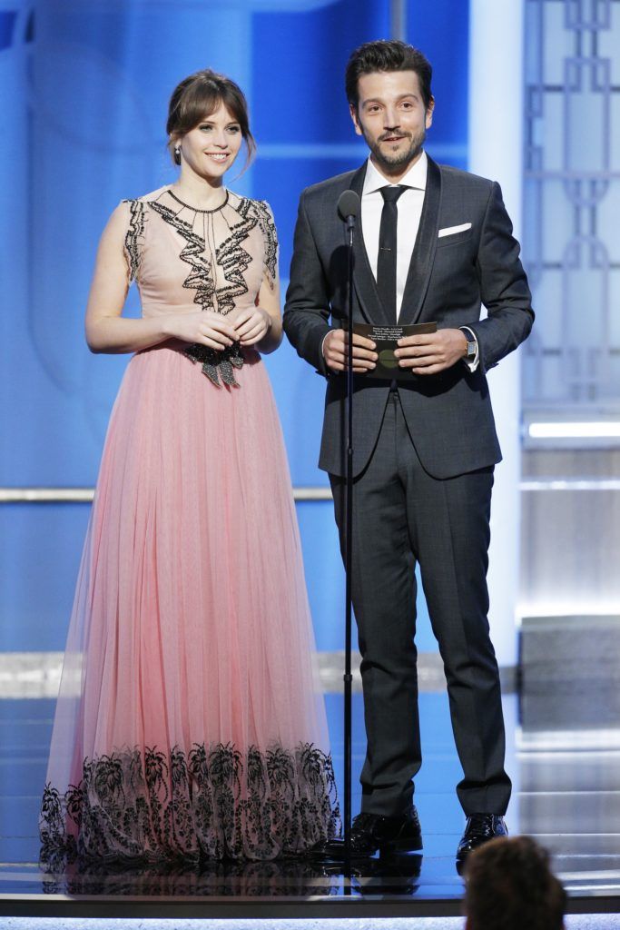 BEVERLY HILLS, CA - JANUARY 08: In this handout photo provided by NBCUniversal, presenters Felicity Jones (L) and Diego Luna onstage during the 74th Annual Golden Globe Awards at The Beverly Hilton Hotel on January 8, 2017 in Beverly Hills, California. (Photo by Paul Drinkwater/NBCUniversal via Getty Images)