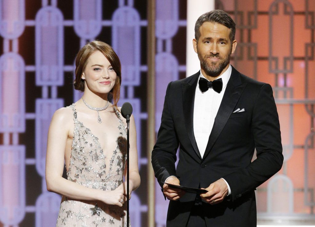 BEVERLY HILLS, CA - JANUARY 08: In this handout photo provided by NBCUniversal, presenters Emma Stone and Ryan Reynolds onstage during the 74th Annual Golden Globe Awards at The Beverly Hilton Hotel on January 8, 2017 in Beverly Hills, California. (Photo by Paul Drinkwater/NBCUniversal via Getty Images)