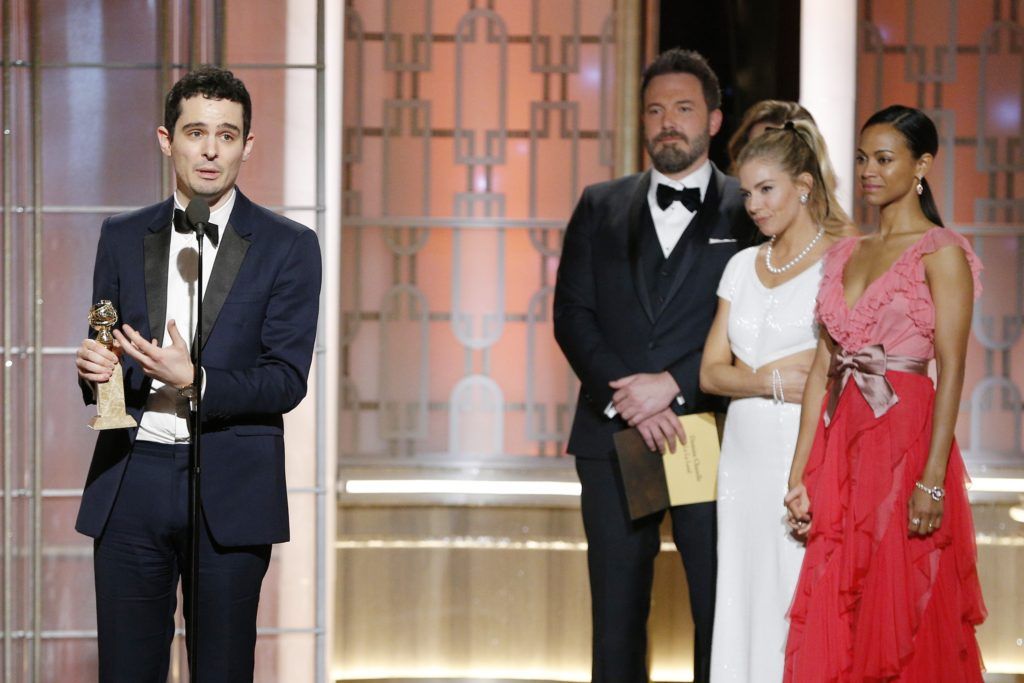 BEVERLY HILLS, CA - JANUARY 08: In this handout photo provided by NBCUniversal, Damien Chazelle accepts the award for Best Director - Motion Picture for " La La Land" onstage during the 74th Annual Golden Globe Awards at The Beverly Hilton Hotel on January 8, 2017 in Beverly Hills, California. (Photo by Paul Drinkwater/NBCUniversal via Getty Images)