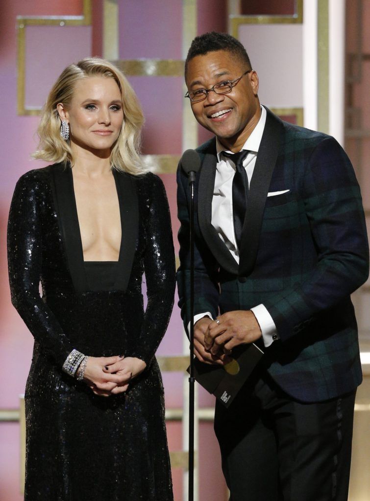BEVERLY HILLS, CA - JANUARY 08: In this handout photo provided by NBCUniversal, presenters Kristen Bell (L) and Cuba Gooding Jr. onstage during the 74th Annual Golden Globe Awards at The Beverly Hilton Hotel on January 8, 2017 in Beverly Hills, California. (Photo by Paul Drinkwater/NBCUniversal via Getty Images)